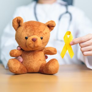 International Childhood Cancer Awareness month, Doctor with Children toy